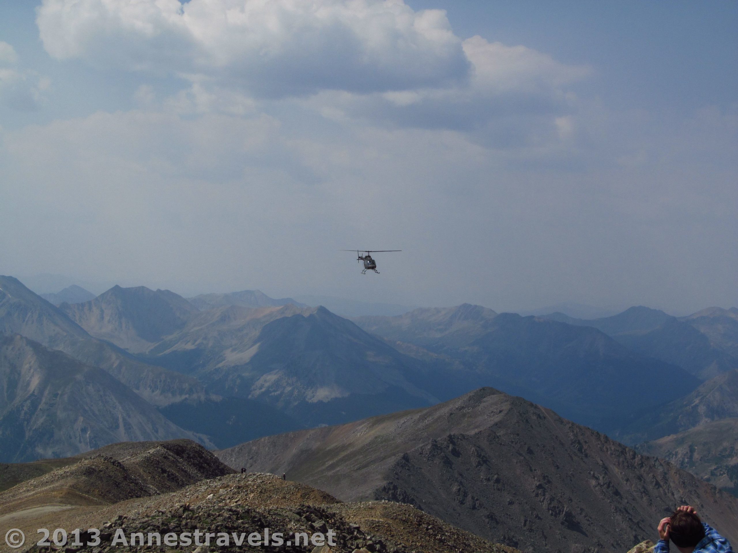A helicopter circles Mount Elbert summit, San Isabel National Forest, Colorado