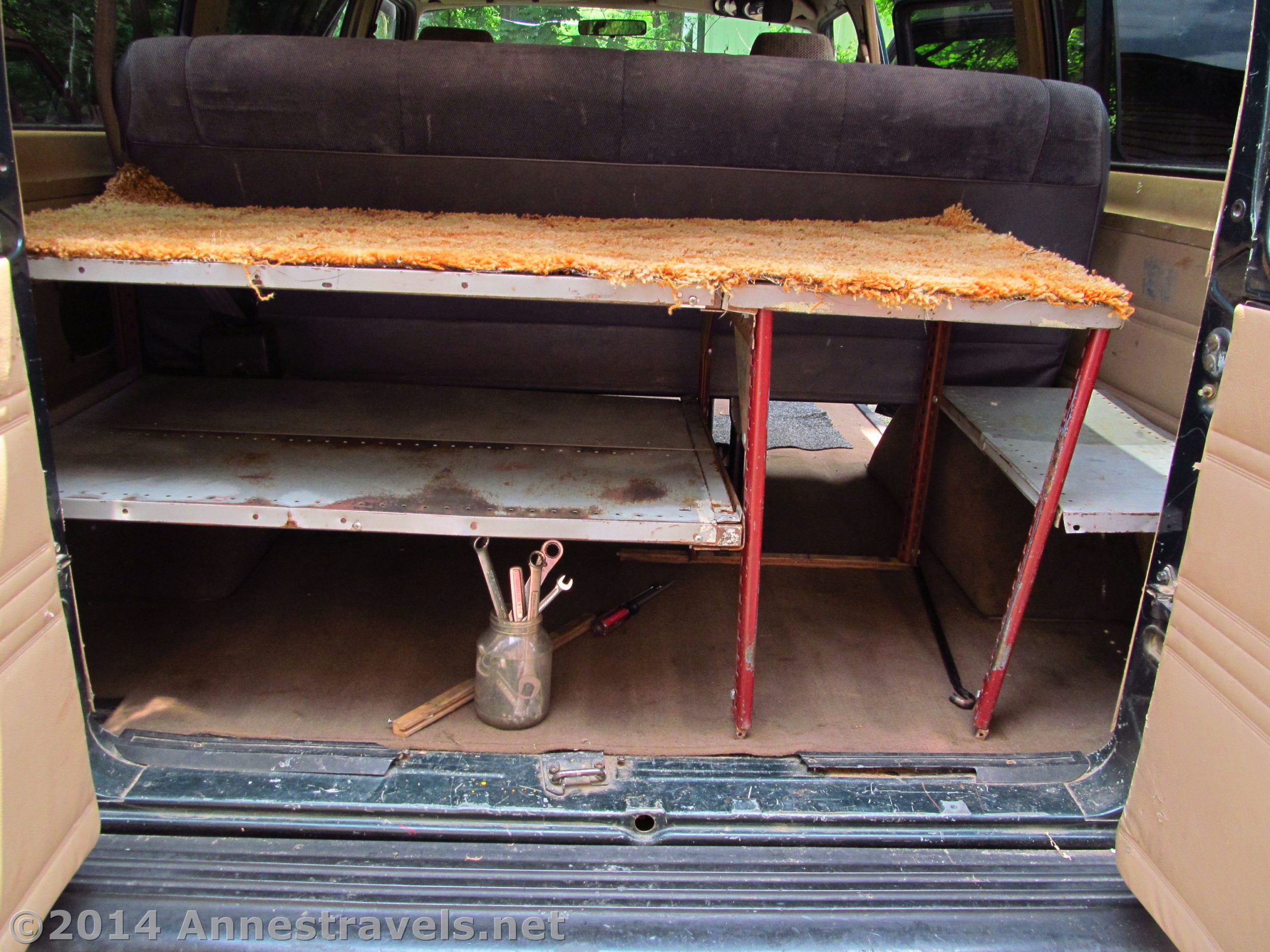 All the shelves in the van, ready for boxes, cooler, and camping supplies