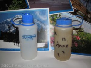 A new narrow mouth Nalgene water bottle and an old Nalgene wide mouth water bottle