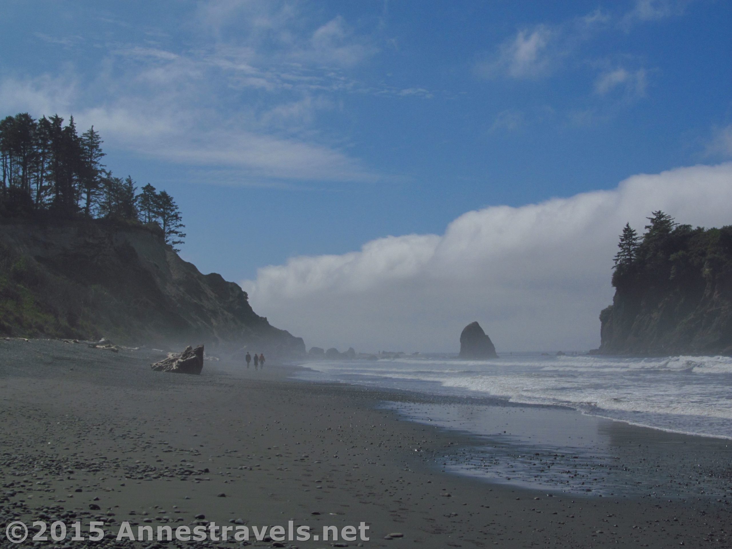 Three hikers brave the mist on Ruby Beach, Olympic National Park, Washington