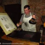 Applying ink to the printing press at Franklin Court, Philadelphia, Pennsylvania. The press is very similar to the one Benjamin Franklin used.