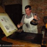 Applying ink to the printing press at Franklin Court, Philadelphia, Pennsylvania. The press is very similar to the one Benjamin Franklin used.