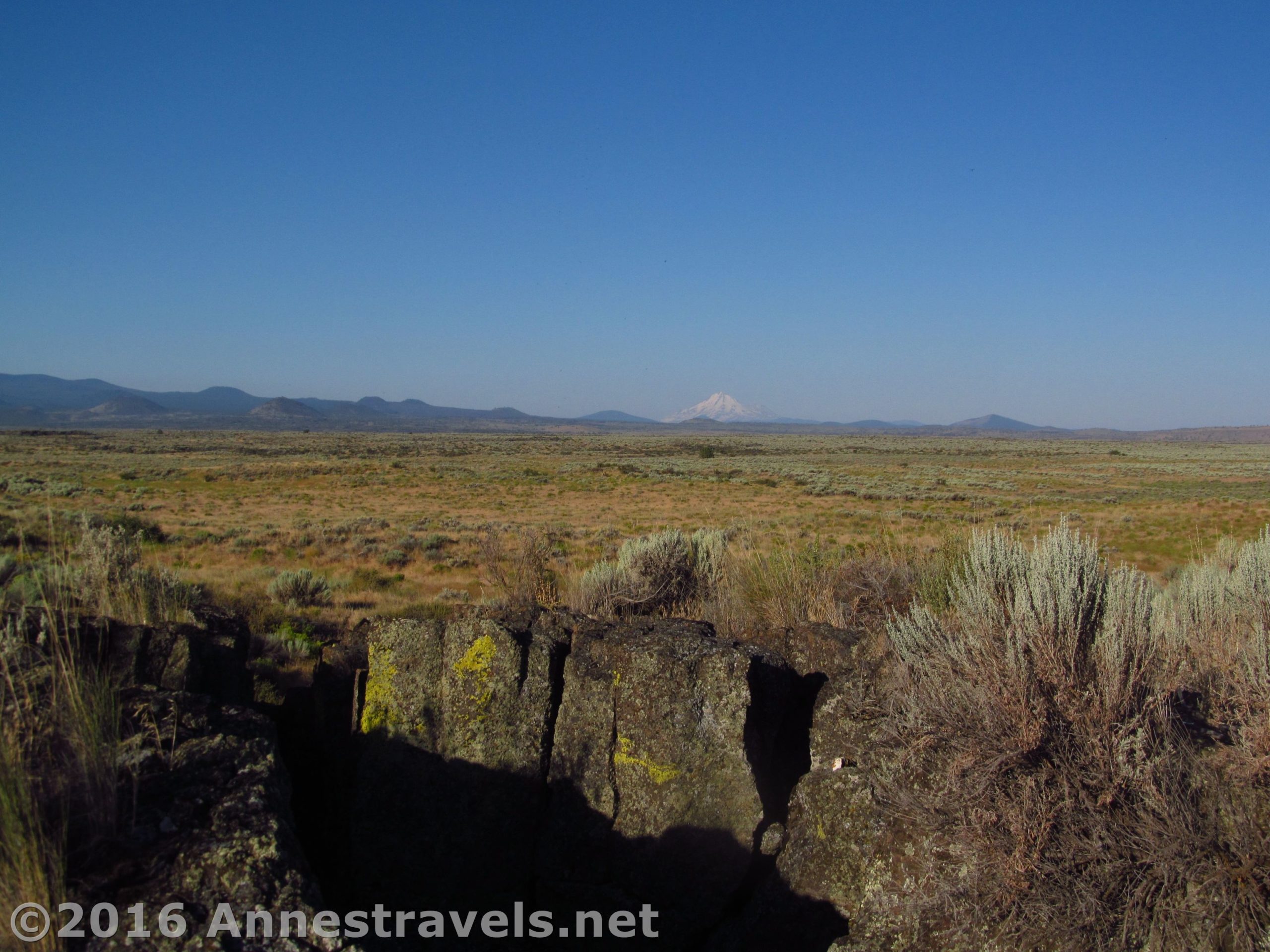 Mt. Shasta as seen across the Big Crack "Slot Canyon" in Lava Beds National Monument, California