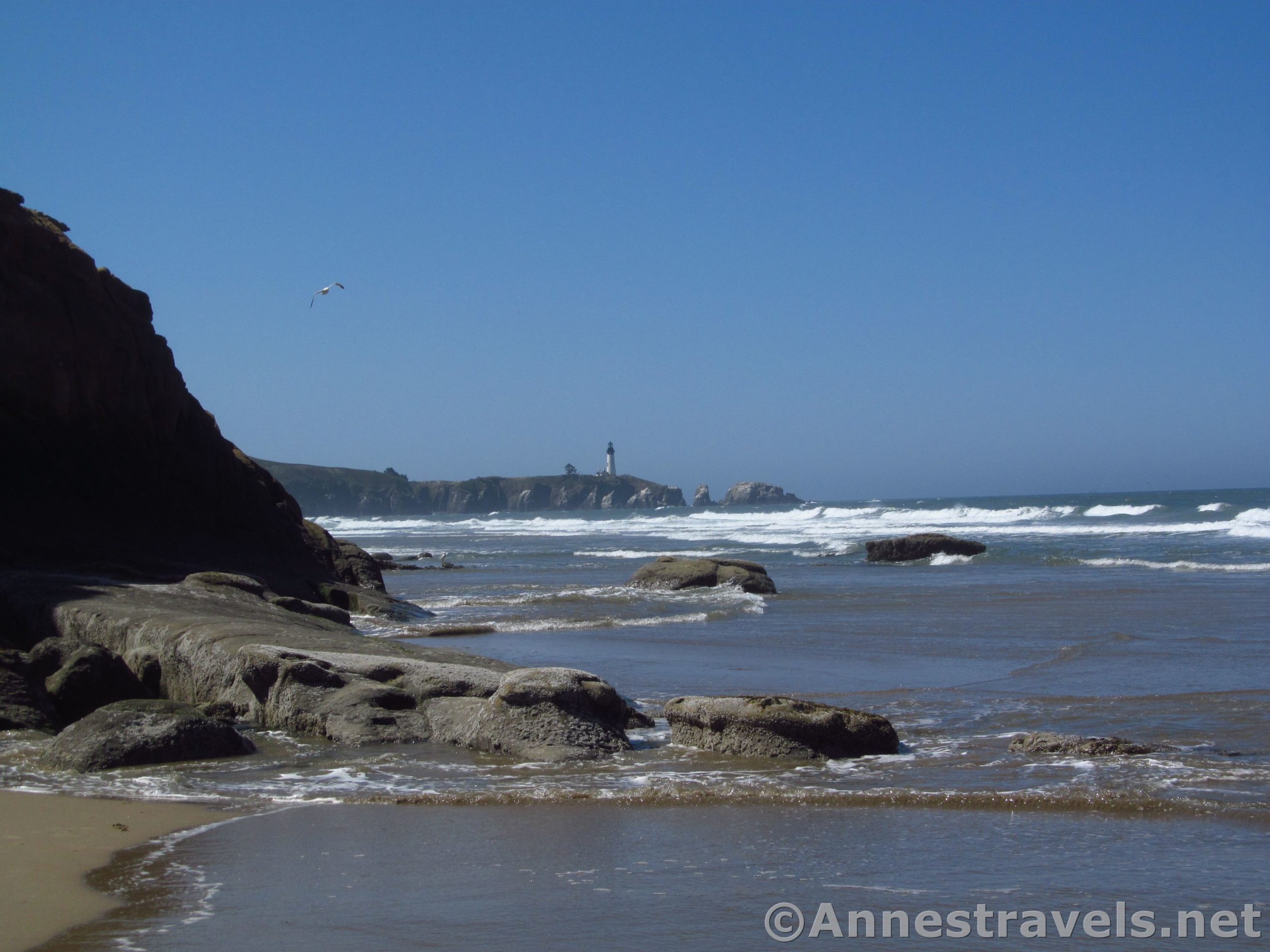 views of the Yaquina Head Light just before rounding Schooner Point south of Beverly Beach and Moolack Beach, Oregon