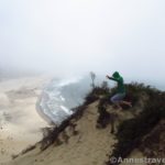 Jumping atop the sand dune at Cape Kiwanda, Oregon