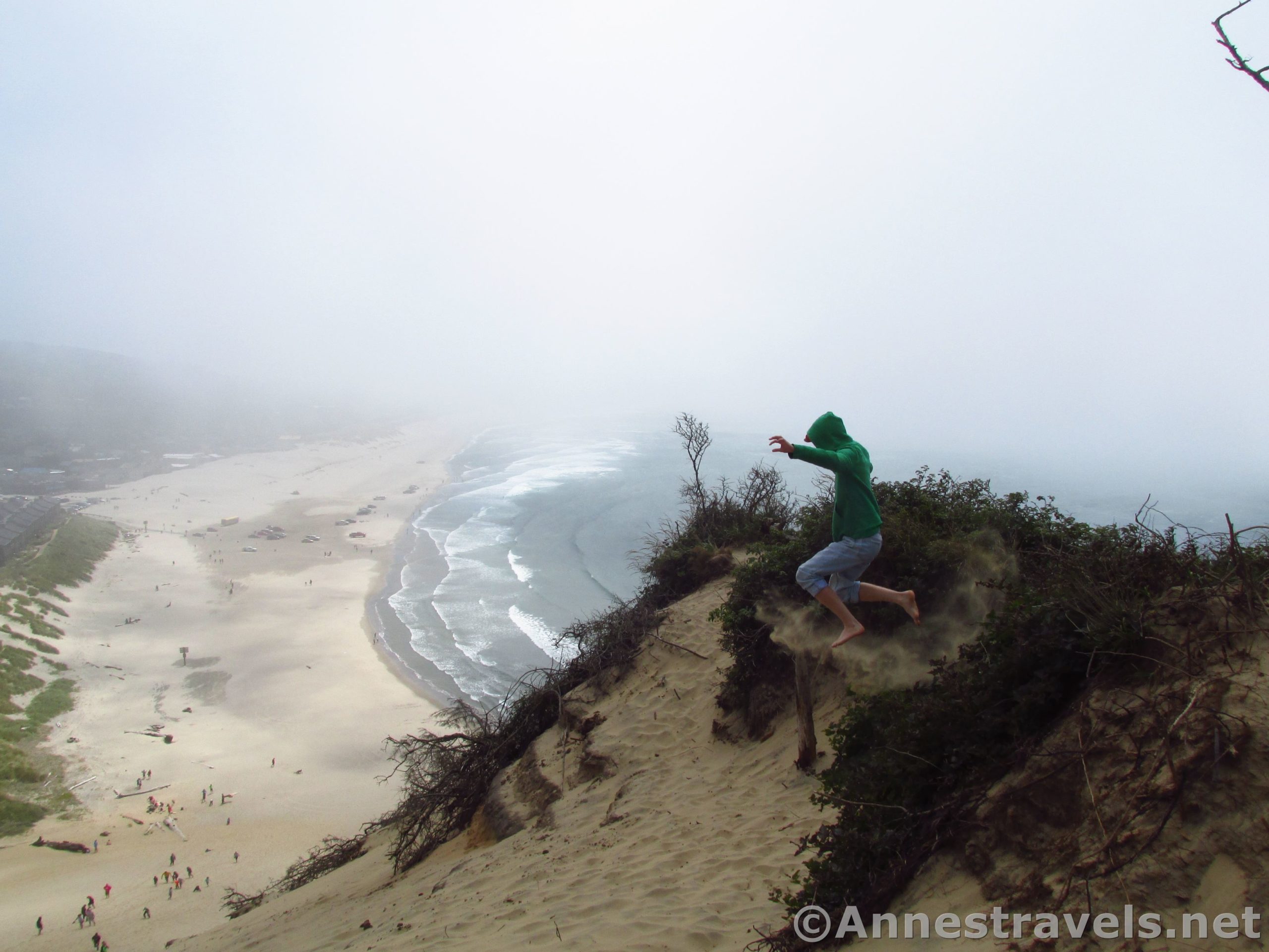 Jumping atop the sand dune at Cape Kiwanda, Oregon