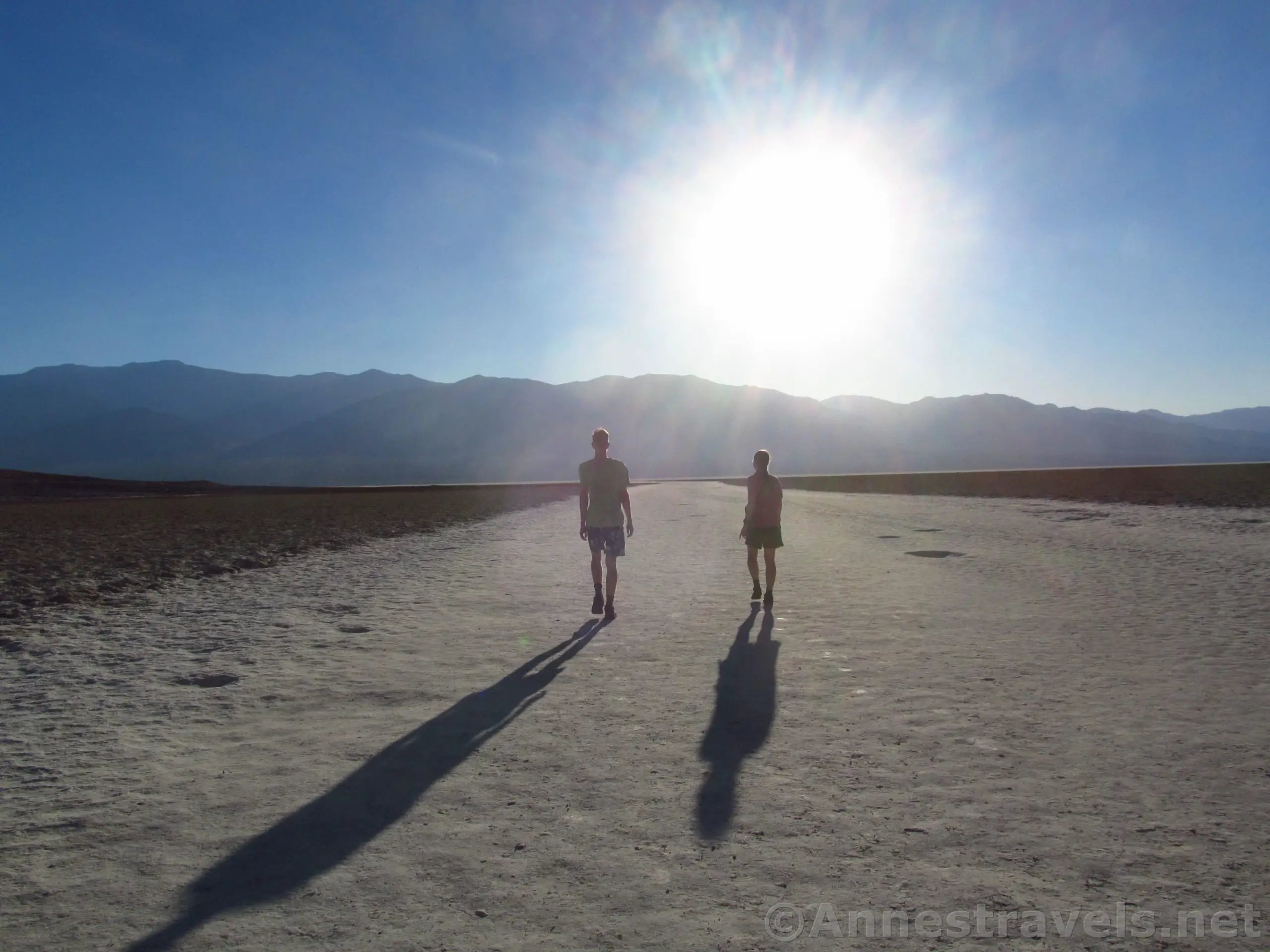 Walking out onto Badwater Basin near sunset in June, Death Valley National Park, California
