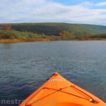 Kayaking near the inlet of Honeoye Lake by the fall colors, New York