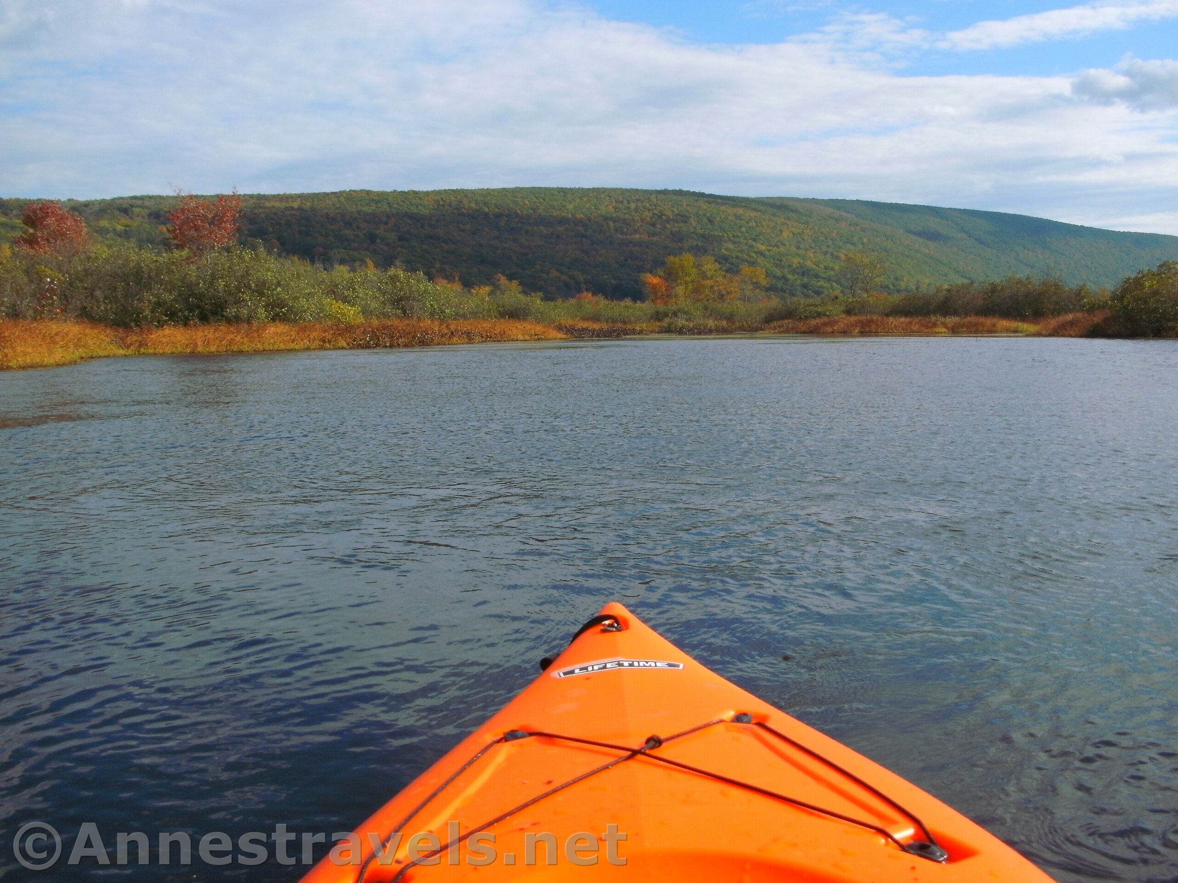 Kayaking near the inlet of Honeoye Lake by the fall colors, New York