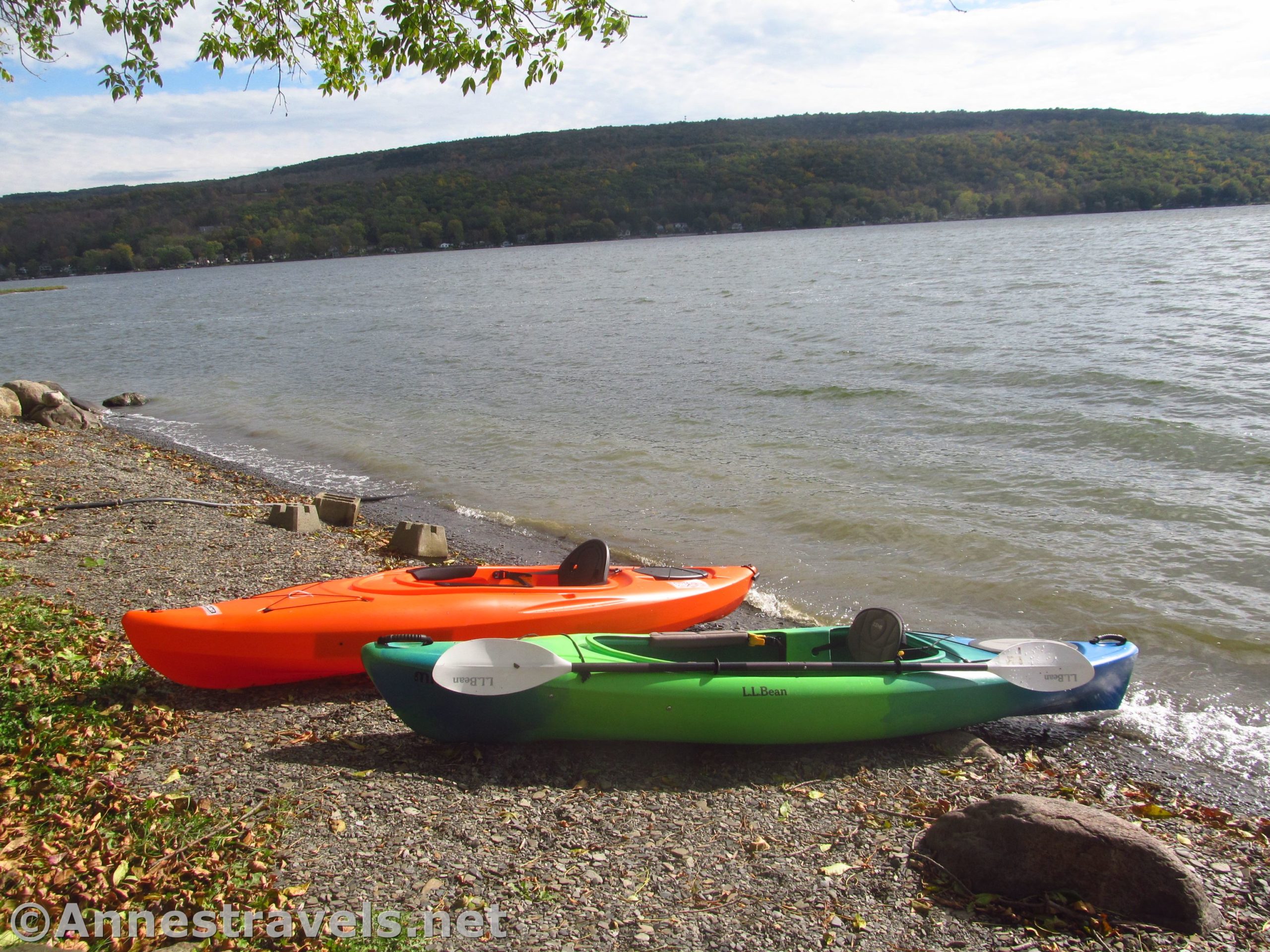 A Lifetime Lancer 100 Kayak and L.L. Bean Manatee 100 Kayak on the shore of the lake