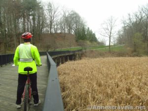 Crossing the bridge over a swamp in Durand Eastman Park on the Irondequoit Lakeside Trail near Rochester, New York