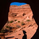 Silhouette of a hiker in The Tunnel, Arches National Park, Utah