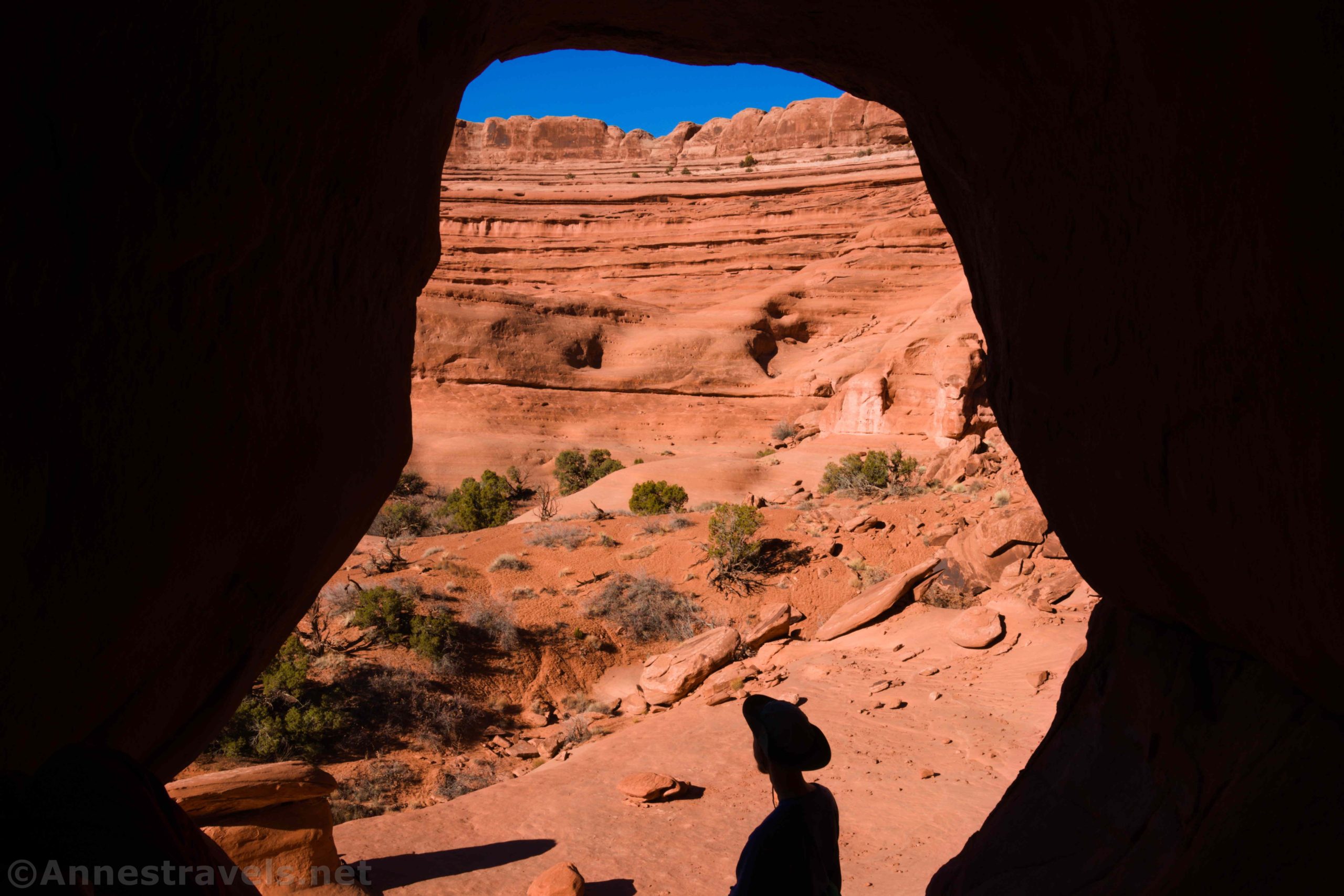 Silhouette of a hiker in The Tunnel, Arches National Park, Utah