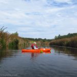 A kayaker pauses in the lower portion of Irondequoit Creek, Rochester, New York