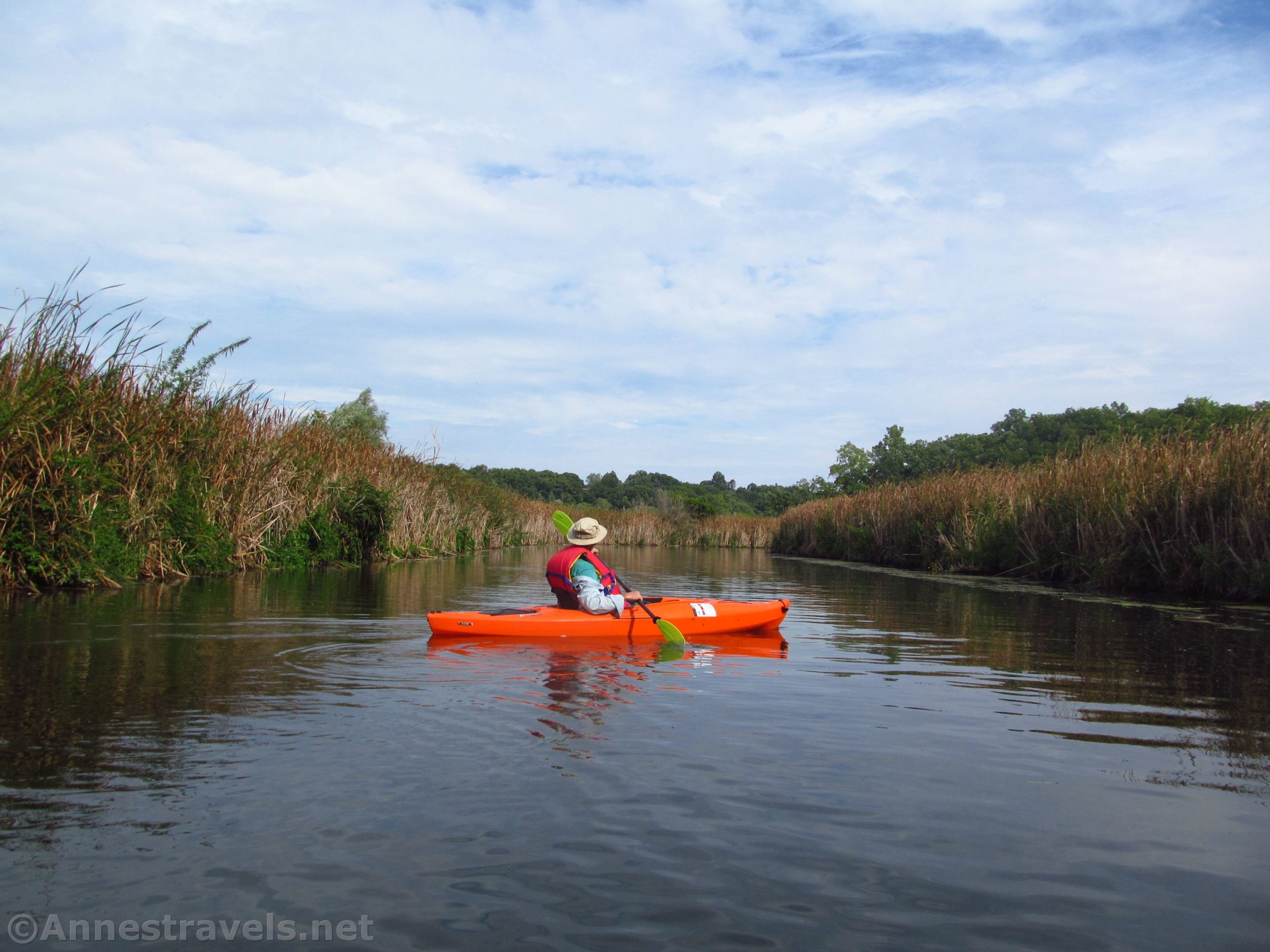 A kayaker pauses in the lower portion of Irondequoit Creek, Rochester, New York