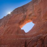 A sun star above Squaw Window, Moab, Utah