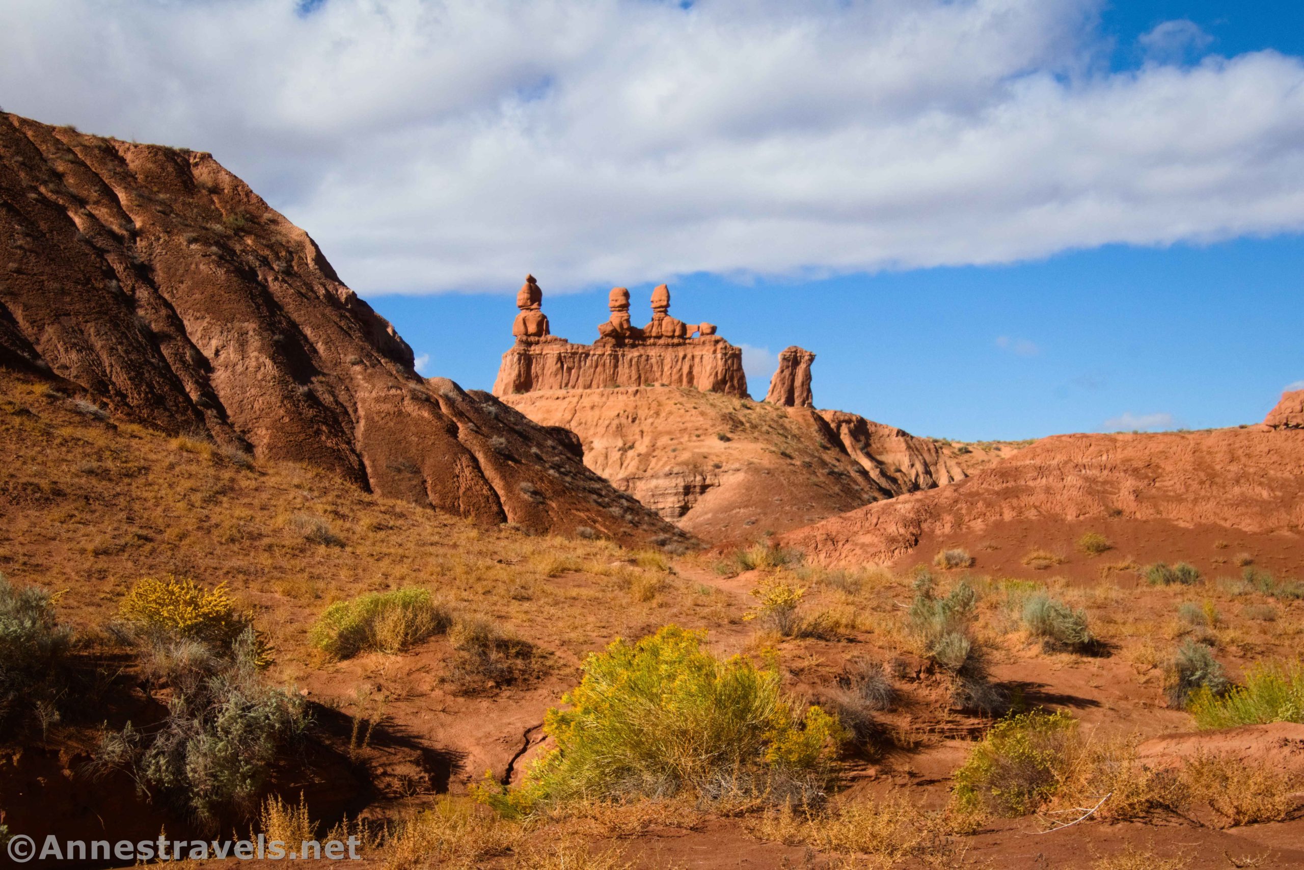 Three Sisters from Caramel Canyon en route to the Goblin's Lair in Goblin Valley State Park, Utah