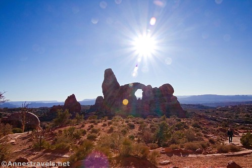 The sun above Turret Arch, Arches National Park, Utah