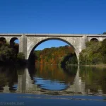 Reflections in the Genesee River of the Veterans Memorial Bridge below Lower Falls, Rochester, New York