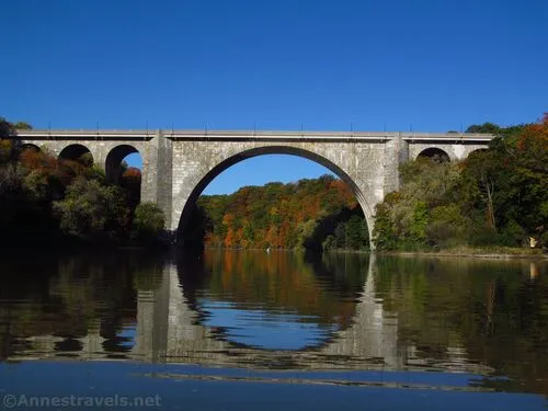 Reflections in the Genesee River of the Veterans Memorial Bridge below Lower Falls, Rochester, New York