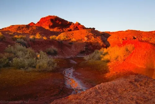 Crossing the creek at the trailhead for Butch Cassidy's Cabin near the Maze District of Canyonlands National Park, Utah