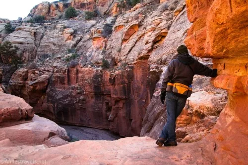 Standing above the first rope-required dryfall in Cove Canyon, Maze District of Canyonlands National Park, Utah