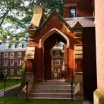 A red brick entryway to a brick building at Harvard
