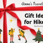 A red ribbon and cute drawings of hikers and a Christmas tree with the text, "Anne's Travels Gift Ideas for Hikers."