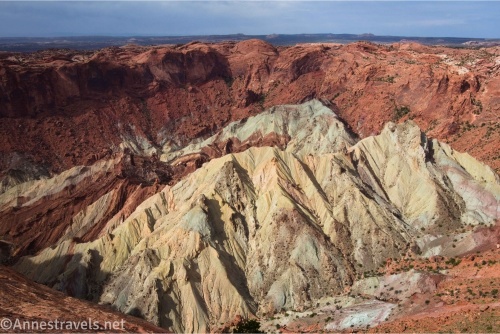 White badlands below the red cliffs of Upheaval Dome in Canyonlands National Park, Utah