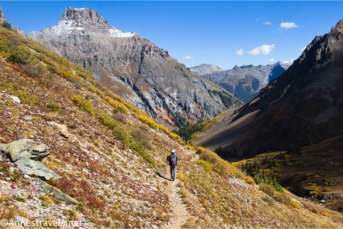 A hiker on a trail below Yankee Boy Basin near Ouray in the San Juan Mountains of Colorado